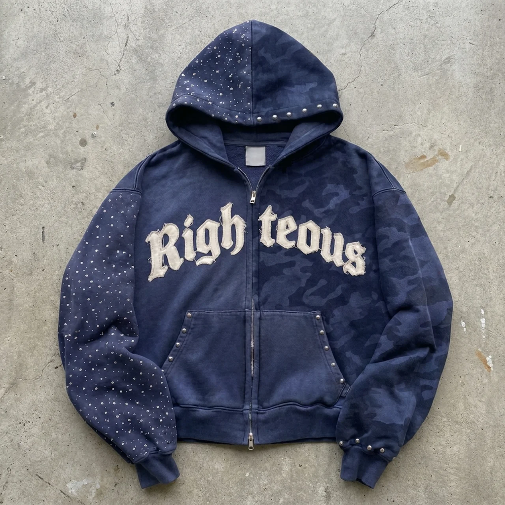 Navy blue hoodie with 'Righteous' text on a concrete surface