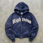 Navy blue hoodie with 'Righteous' text on a concrete surface