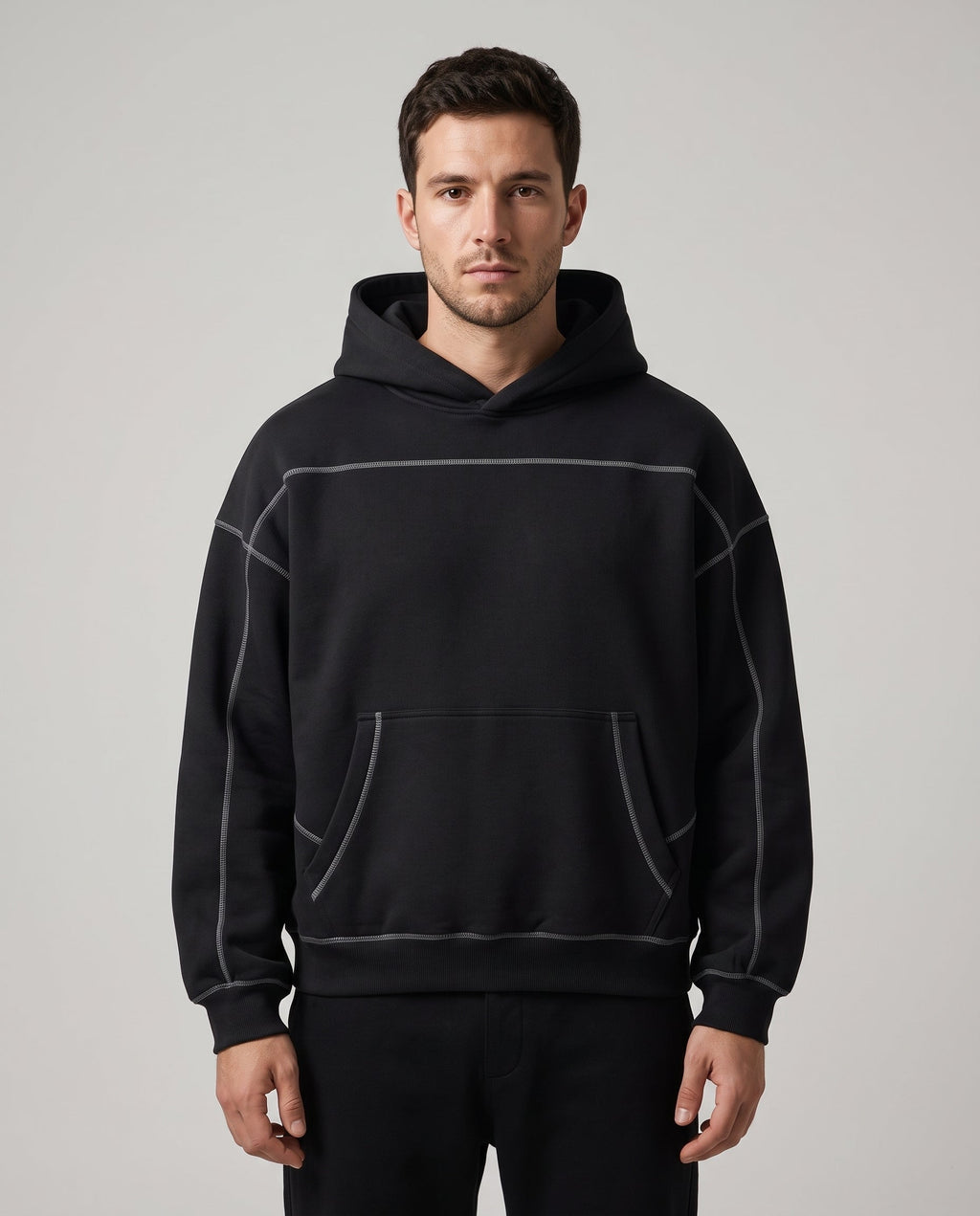 Righteous Contrast-Stitched Boxy Fleece Hoodie in black, front view on a model