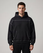 Righteous Contrast-Stitched Boxy Fleece Hoodie in black, front view on a model
