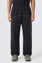 Righteous Contrast-Stitched Fleece Sweatpants in black, worn, front view of the legs