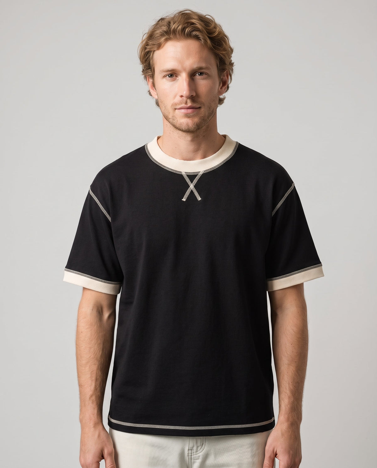 Righteous Unisex Contrast-Stitched Ringer T-Shirt, black with apricot, front on a model