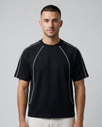 Righteous Contrast Stitch Raglan T-Shirt in black, front on a model