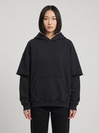 Righteous Snow Washed Raw Edge Double Layered Hoodie in black, front on a model