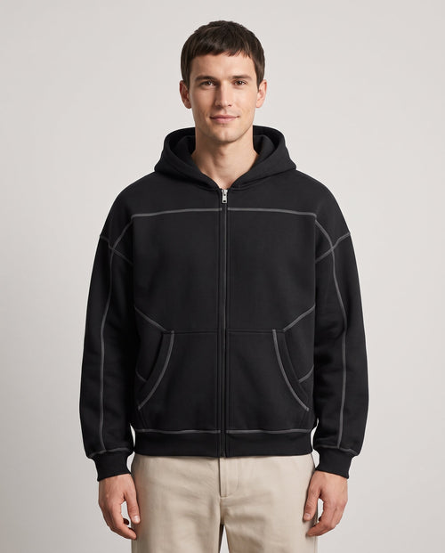 Righteous Contrast-Stitched Boxy Fleece Zip Hoodie in black, front on a model