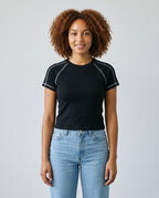 Righteous Women's Contrast Stitch Raglan T-Shirt in black, front on a model