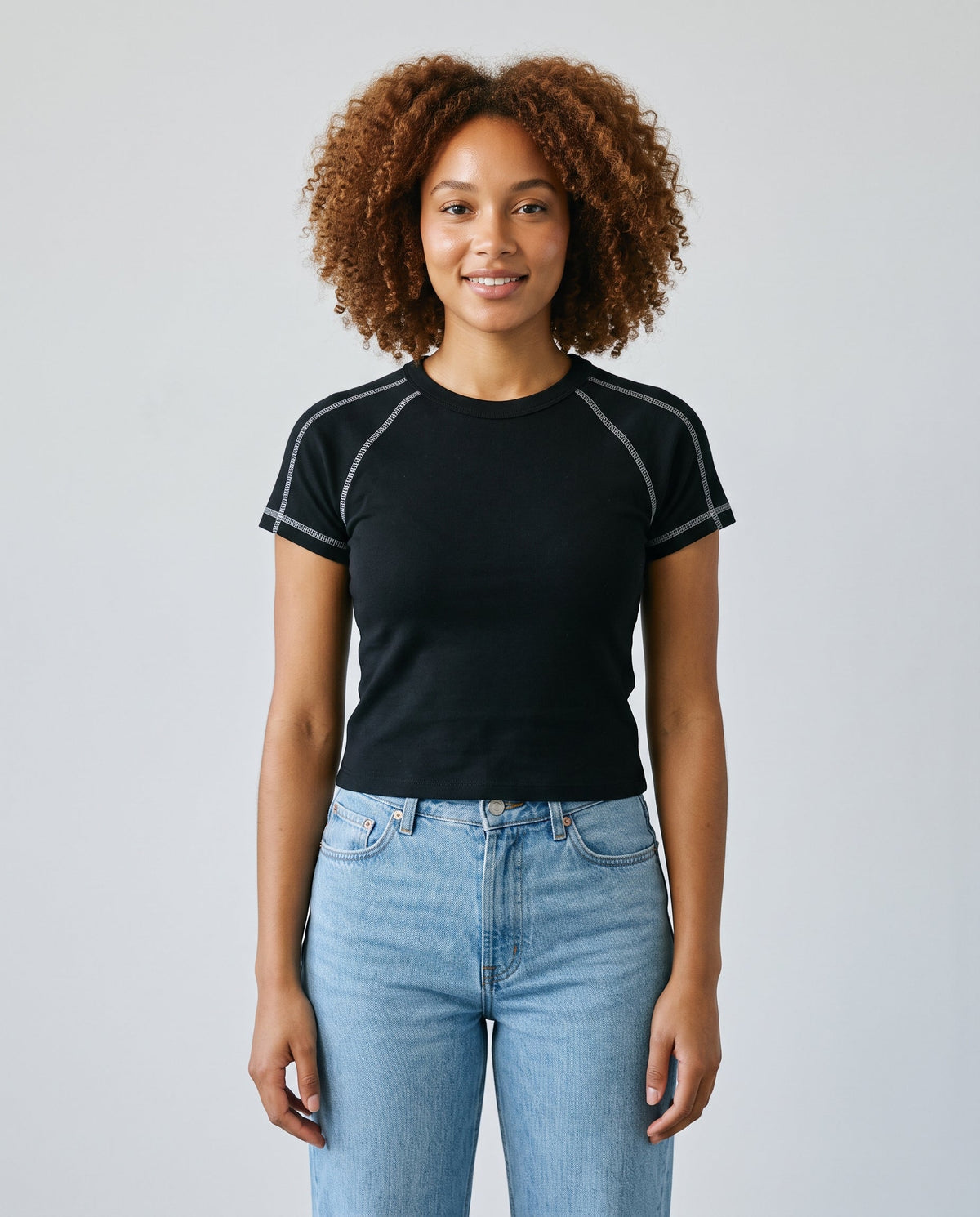 Righteous Women's Contrast Stitch Raglan T-Shirt in black, front on a model
